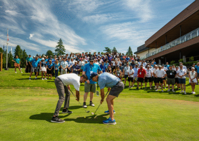 Mike Gibson and Gary Aulakh face off on the green watched by a crowd of spectators