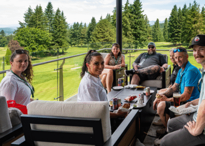 6 or so golfers rest on a patio