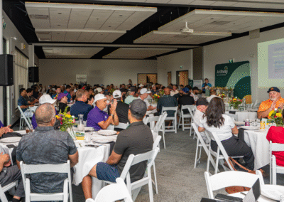 A full room of golfers attending dinner